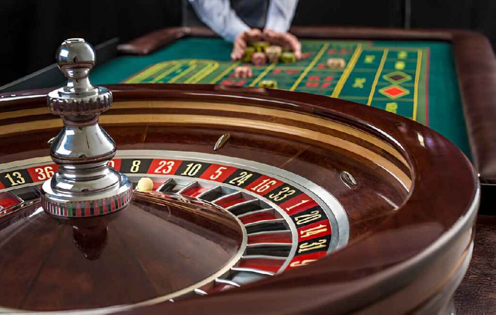 Roulette table with a spinning wheel and colorful chips